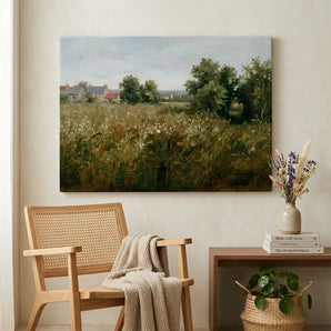 Framed landscape canvas print in cozy living room with wooden chair and decorative vase.