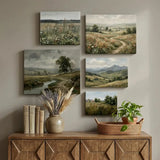 Gallery wall of five landscape canvas prints above wooden console with books, vase, and plant.