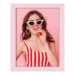 Custom pink frame with portrait of smiling woman in striped top and cat-eye sunglasses