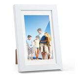 White picture frame displaying a family photo, perfect for custom home decor