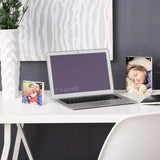 Modern desk with personalized acrylic photo frames, laptop, and white vase for custom home decor