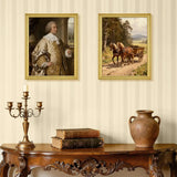Classic living room decor with ornate wooden table, vintage candle holder, stacked antique books, rustic vase, and two gold-framed wall art prints—one of a historical portrait and one of horses pulling a cart.