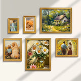 Gallery wall with gold frames featuring floral art, cottage landscape, people, and pets
