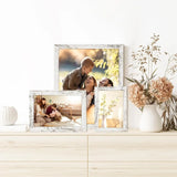 Rustic white photo frames with family pictures and floral print on a light wood dresser
