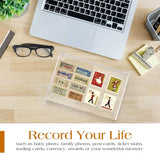 Custom acrylic frame displaying vintage tickets and stamps on a modern office desk with a laptop.
