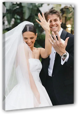 Custom canvas print featuring a smiling bride and groom in wedding attire outdoors