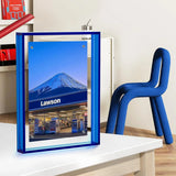 Blue acrylic photo frame featuring a Lawson store and Mount Fuji, displayed on a modern desk