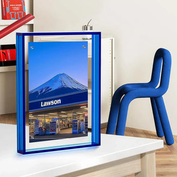 Blue acrylic photo frame featuring a Lawson store and Mount Fuji, displayed on a modern desk
