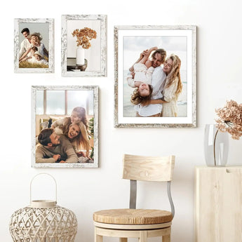 Gallery wall with custom photo frames and canvas prints in a modern home decor setting