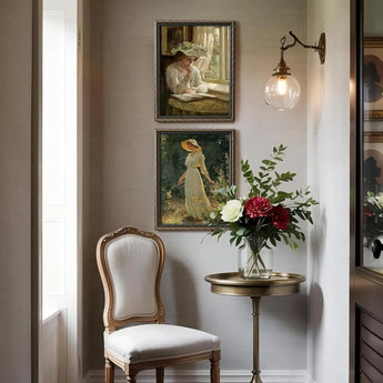 Elegant hallway with floral art prints in ornate frames, classic chair, side table, and flower vase