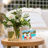 Personalized acrylic photo frame on side table with fresh flower bouquet, home decor accent
