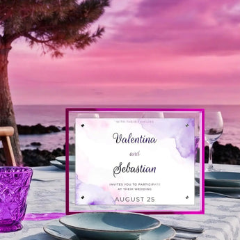 Custom acrylic wedding invitation frame with purple accents on outdoor table at sunset