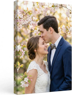 Custom canvas print of a couple smiling under blooming cherry blossoms, romantic home decor