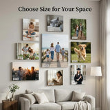 Gallery wall of custom canvas photo prints in various sizes above a modern sofa