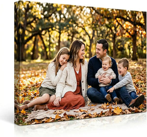 Custom canvas print of a happy family sitting outdoors on autumn leaves