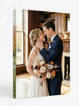Custom canvas print of a bride and groom embracing with wedding bouquet indoors