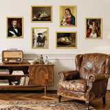 Vintage living room with classic art prints in gold frames, leather armchair, and wooden cabinet.