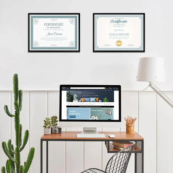 Modern home office with computer, framed certificates, cactus, and personalized decor