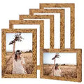 Set of rustic wooden picture frames with personalized photo in a natural field setting